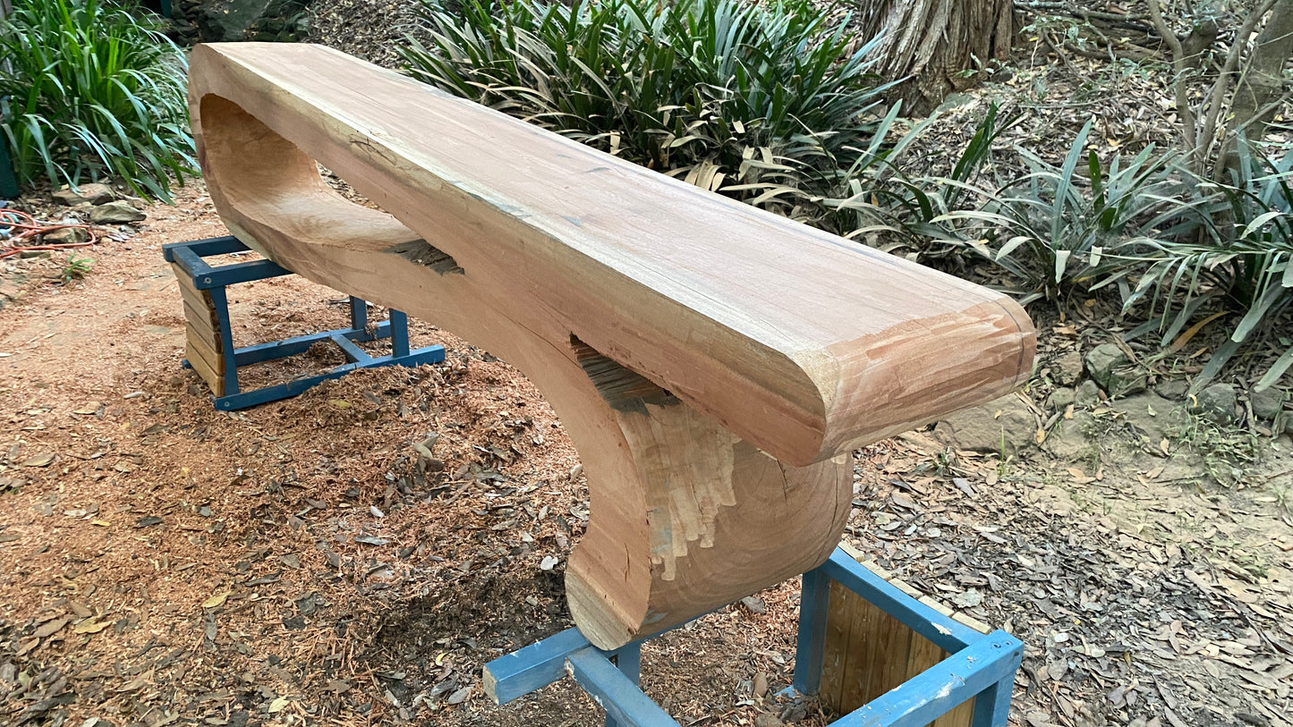 Single piece bench seat free-flowing sculpture